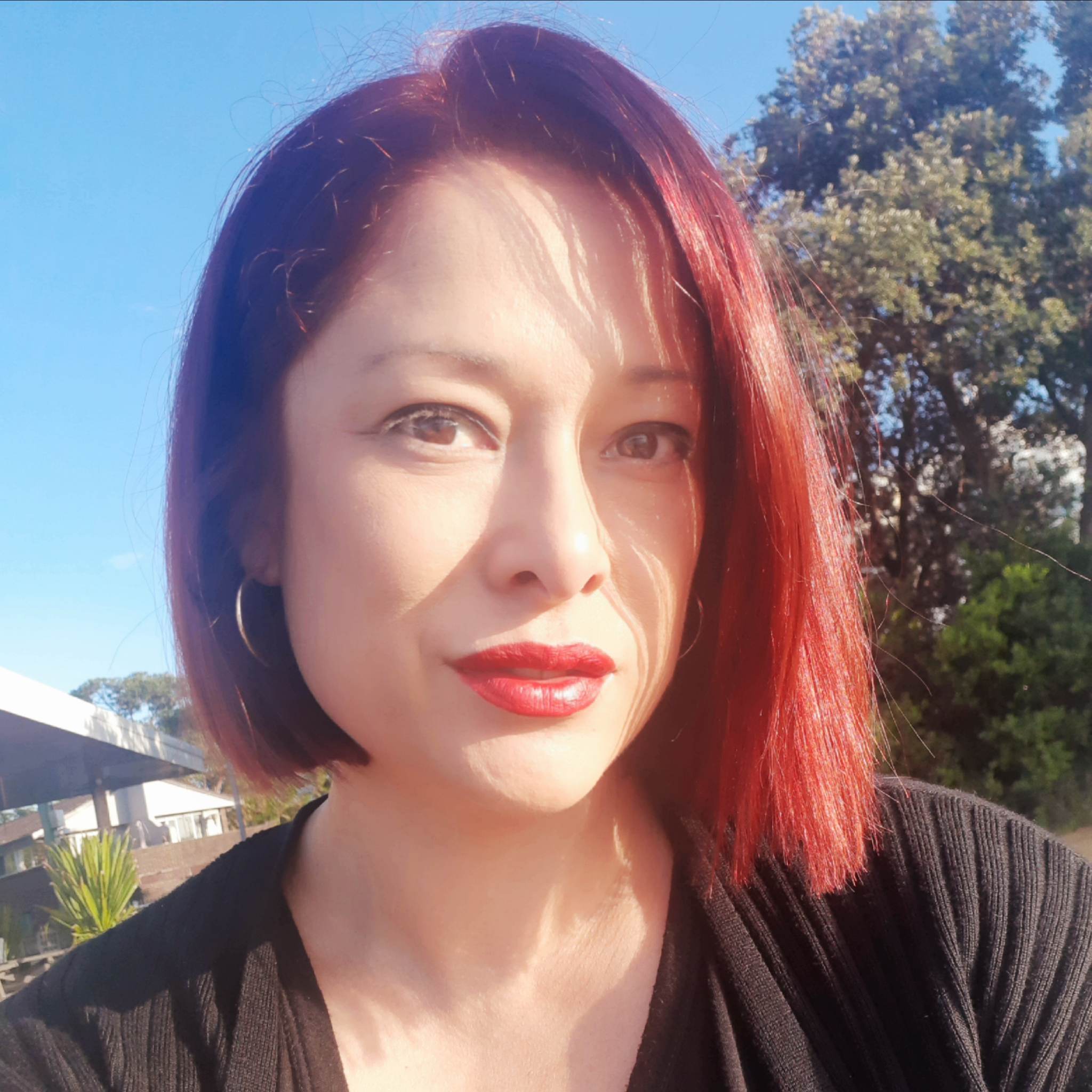 The Salty Salon Woy Woy Central Coast hairdresser stylist Jules with red hair